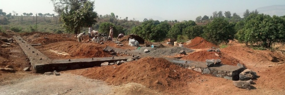 The foundations and plinth of the bungalow being made of local black stone.